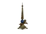 une image représentant une statue surmontée d'une boule bleue