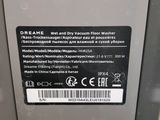 the back of a machine with a label on it ' s side