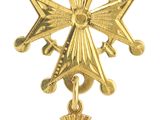 une image représentant une croix en or surmontée d'une étoile