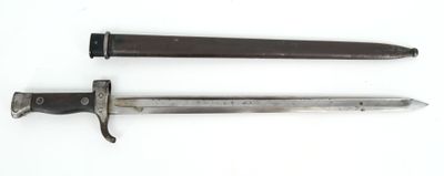 an old knife and a small knife on a white surface