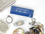 many different types of jewelry on a white table