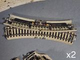 two sets of model train tracks on the table