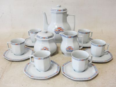 a lot of cups and saucers sitting on the floor