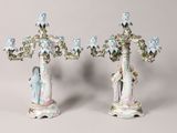 pair of antique porcelain candelabs with figurines and flowers