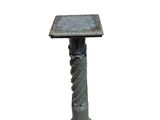 a stone pedestal with a marble top on a white background