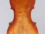 an old violin with a wooden back and a long neck