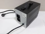 a black power supply sitting on a white table