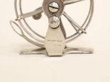 a metal fan that is sitting on top of a table