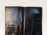 an image of a black leather wallet on a white background
