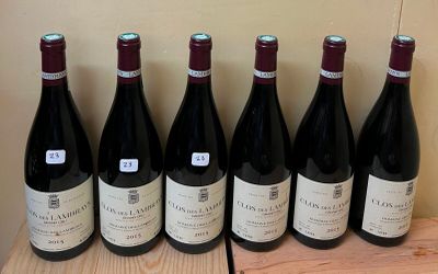 six bottles of wine are lined up on a wooden shelf