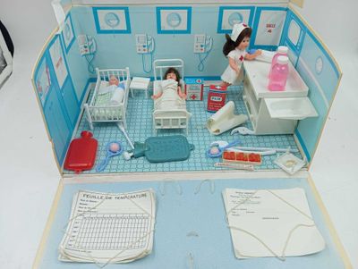 a doll house with a doll in the middle of it