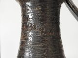 a vase that has a handle on it