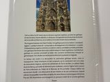 the back cover of a book with a picture of a cathedral in the background