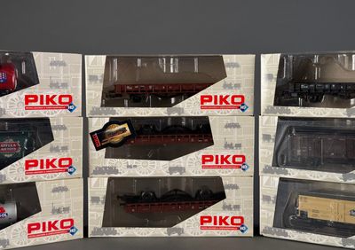six boxed boxes of piko model trains sitting on top of each other
