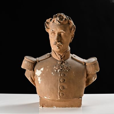 a bust of a man in a military uniform on a table