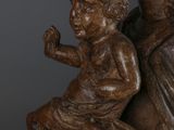 an image of a statue of a woman holding a child