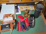 a desk with a lot of office supplies on it