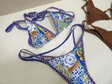 a bikini and a bikini top laying on a table