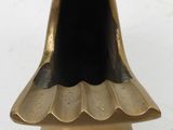 gold metal incense holder with a black top