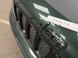 a close up of a car with a sticker on it ' s hood