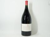 a bottle of wine that is sitting on a table