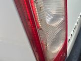 a close up of the tail light of a white car