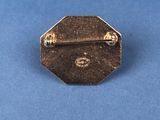 a close up of a small metal object on a blue surface