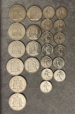 a lot of coins that are sitting on a table