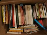 a box full of books that are sitting on a table