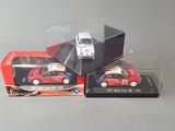 three toy cars that are in a box on a table