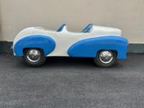 a blue and white toy car parked in a parking lot