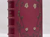 a red book sitting on top of a white table