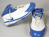 pair of blue and white sneakers with white laces on them