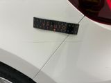 a close up of a sticker on a car ' s hood