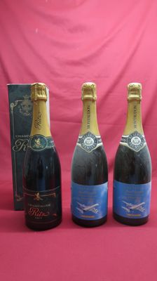 three bottles of champagne and a box of wine on a pink background