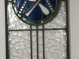 a stained glass window with a blue and green design on it