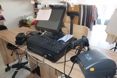 a desk with a computer and a printer on top of it
