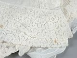 a close up of a piece of lace on a table