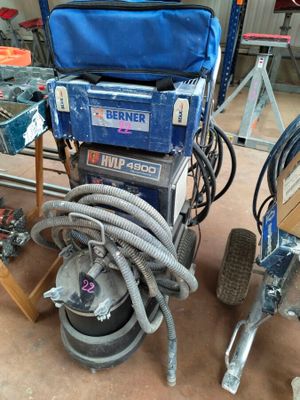 a machine that is sitting on the floor next to some tools