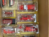 a lot of toy fire trucks in a box