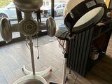 a hair dryer and a hair dryer on a stand in a room