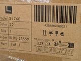 a box with a price label on it that is wrapped in plastic