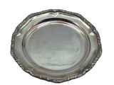 an antique silver plate on a white background with a white background