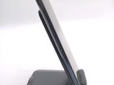a close up of a cell phone on a stand