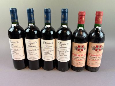 six bottles of wine are lined up in a row on a table