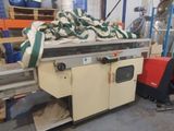a machine that is sitting in a warehouse with other machines