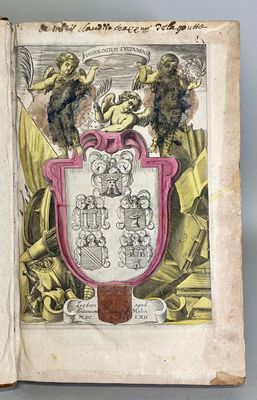 an open book with a drawing of a coat of arms on it