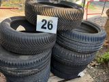 several tires are stacked on a pallet with a number 28 on them