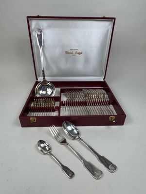 a box with silverware in it on a table