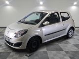 a picture of a small silver car parked on a checkered floor